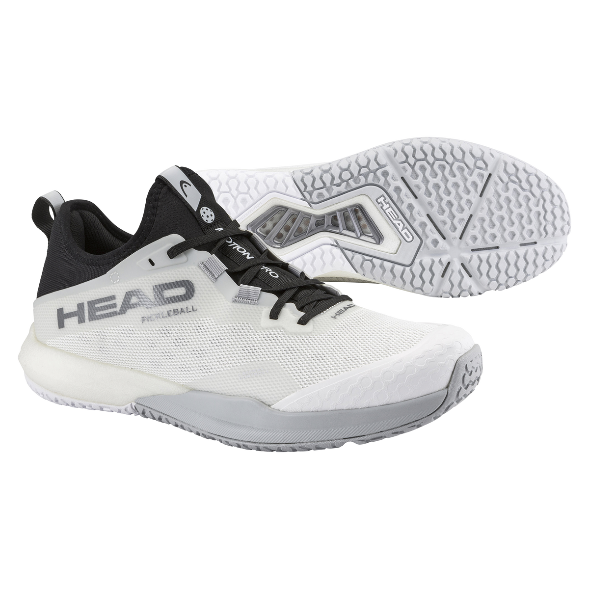 Product image of the HEAD Motion Pro Pickleball shoe in white and black, featuring a lightweight mesh upper, reinforced toe cap, lateral support frame, and a non-marking rubber outsole, shown from side and outsole views.