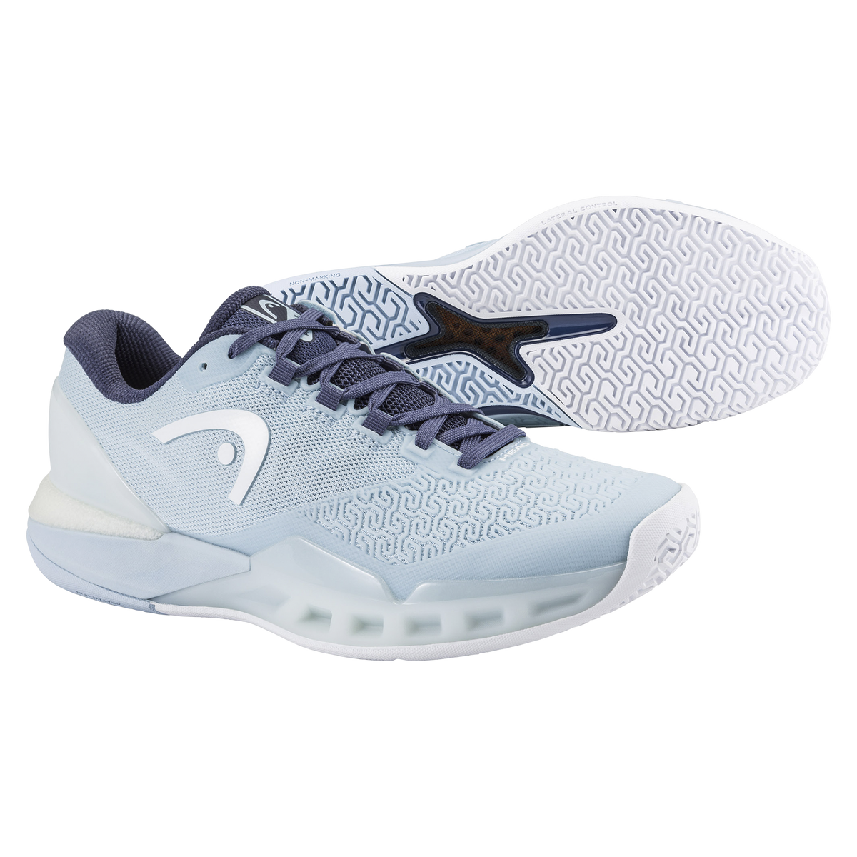 Studio product image of HEAD Revolt Pro 5.0 women’s tennis shoes in light blue, showing a side profile with a second shoe angled to reveal the non-marking outsole, highlighting breathable mesh, reinforced toe protection, and stability-focused court traction on a black background.