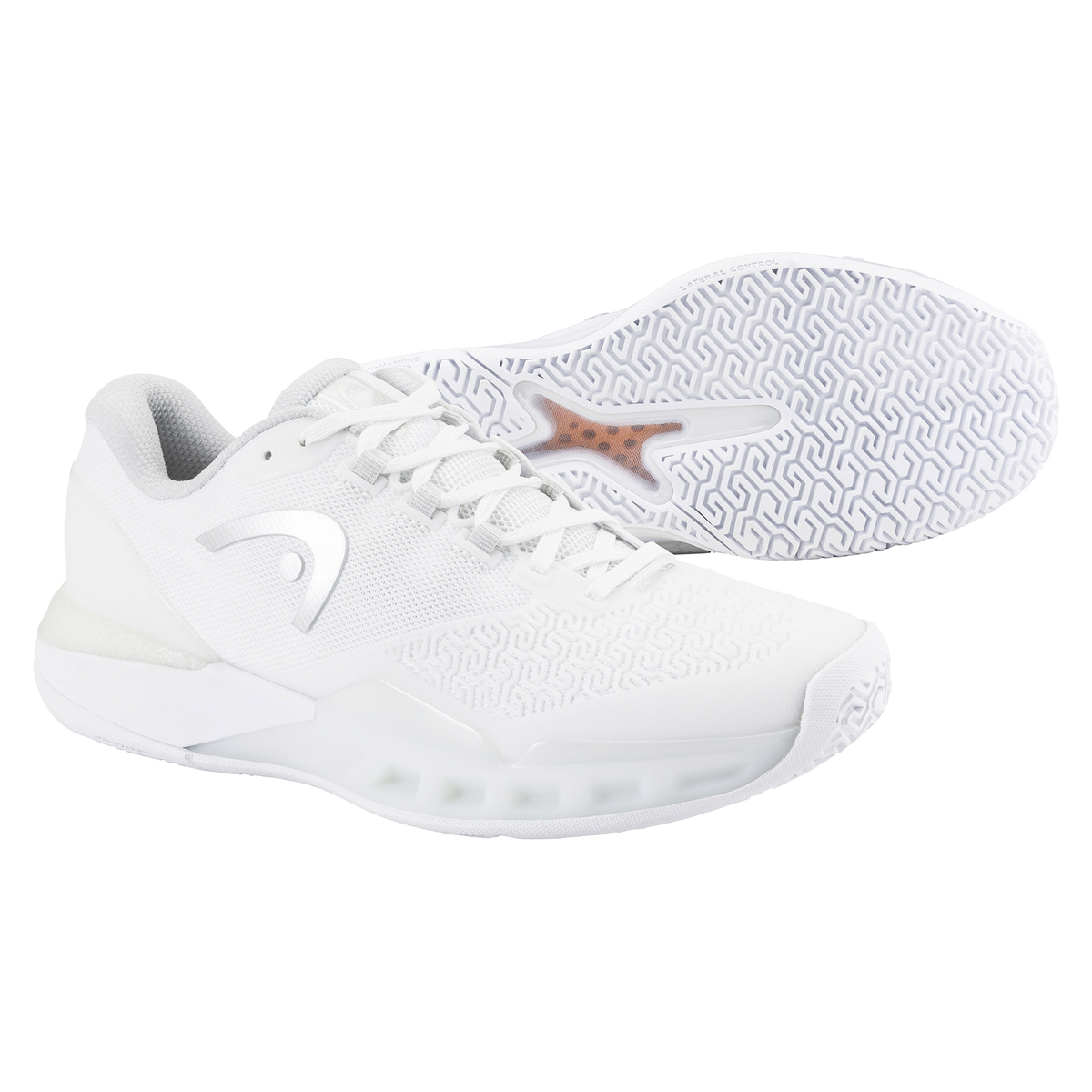 White HEAD Revolt Pro 5.0 women’s tennis shoe shown with a matching outsole, featuring a breathable mesh upper, cushioned midsole, and patterned non-marking rubber sole on a black background.