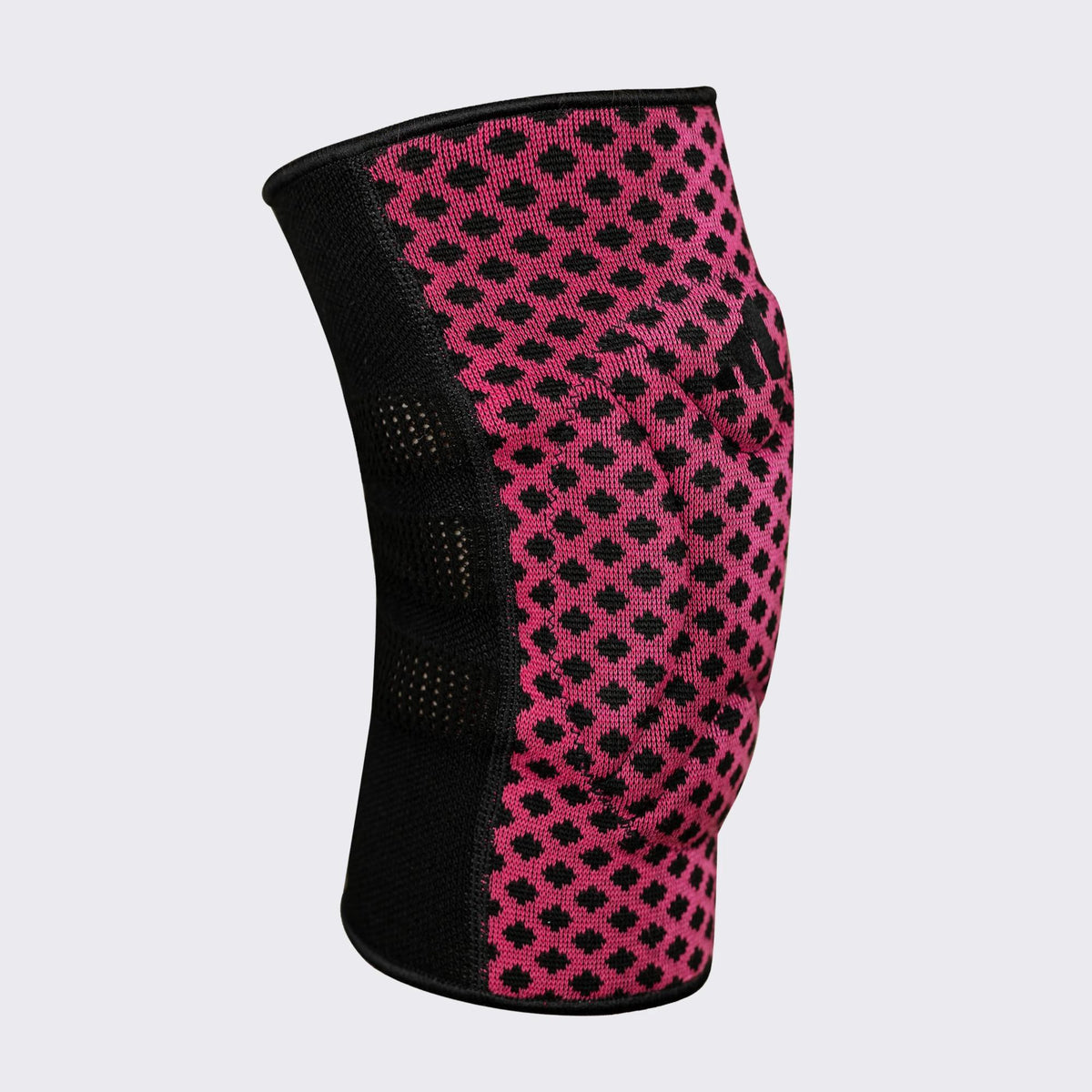 Adidas reversible wrestling kneepad in pink and black with EVA foam padding, breathable mesh back, and compression fit for impact protection and stability.