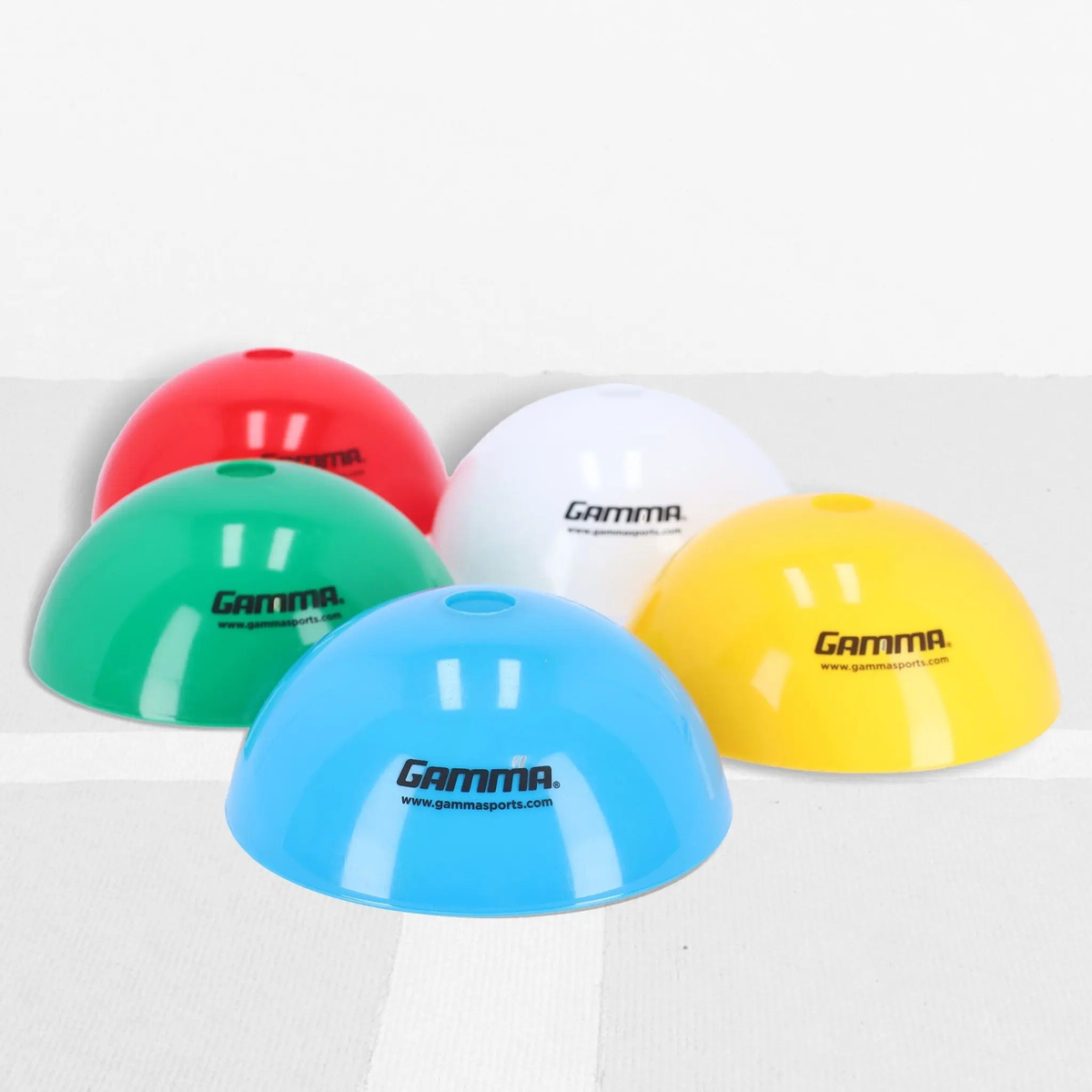 Set of dome-shaped training cones used for marking positions, drills, and boundaries on courts or fields.
