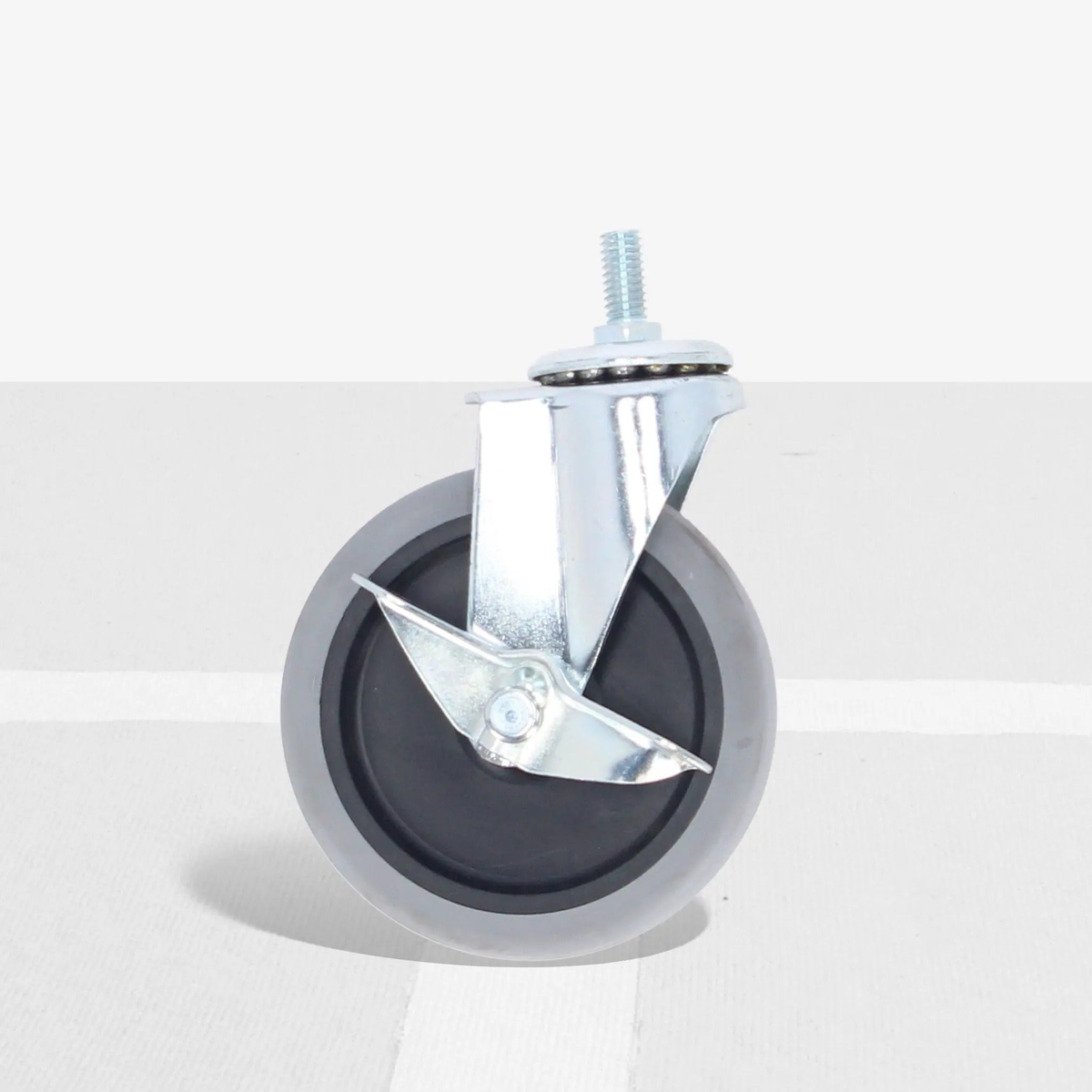 Replacement caster wheel with locking brake mechanism and metal mounting bracket for secure travel cart mobility.