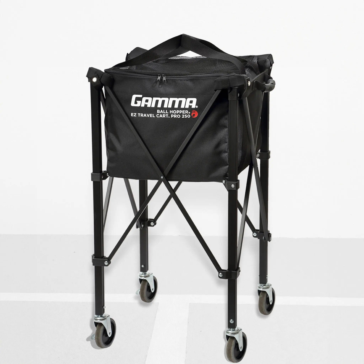 Portable ball hopper cart with rolling wheels, collapsible frame, and attached storage basket for transporting sports balls.