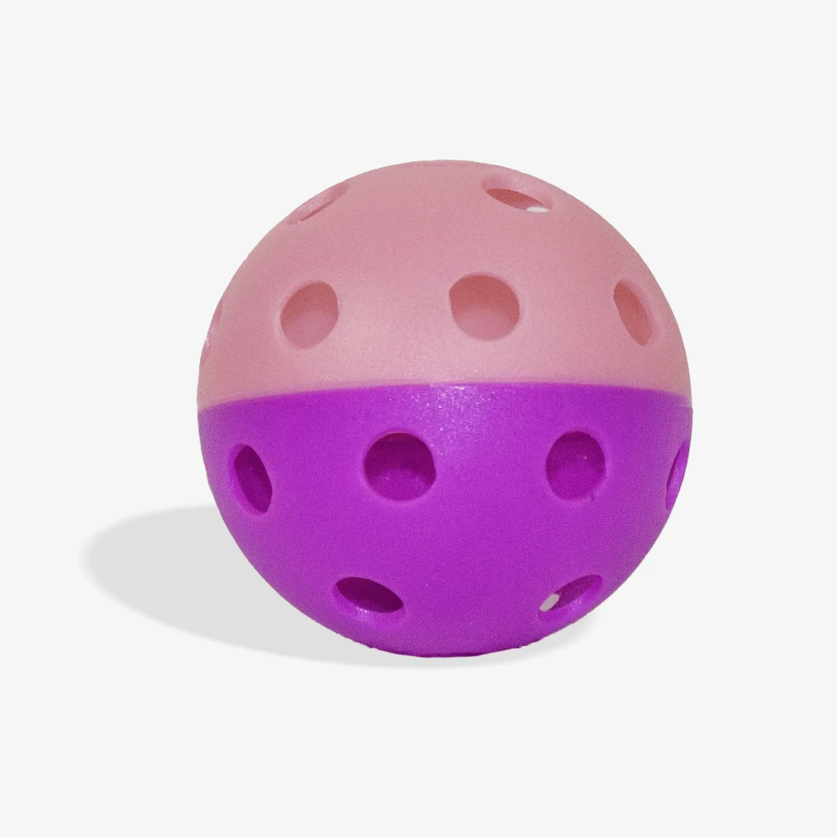 Indoor training pickleball with a two-piece design and evenly spaced holes, built for controlled play and consistent bounce during practice.
