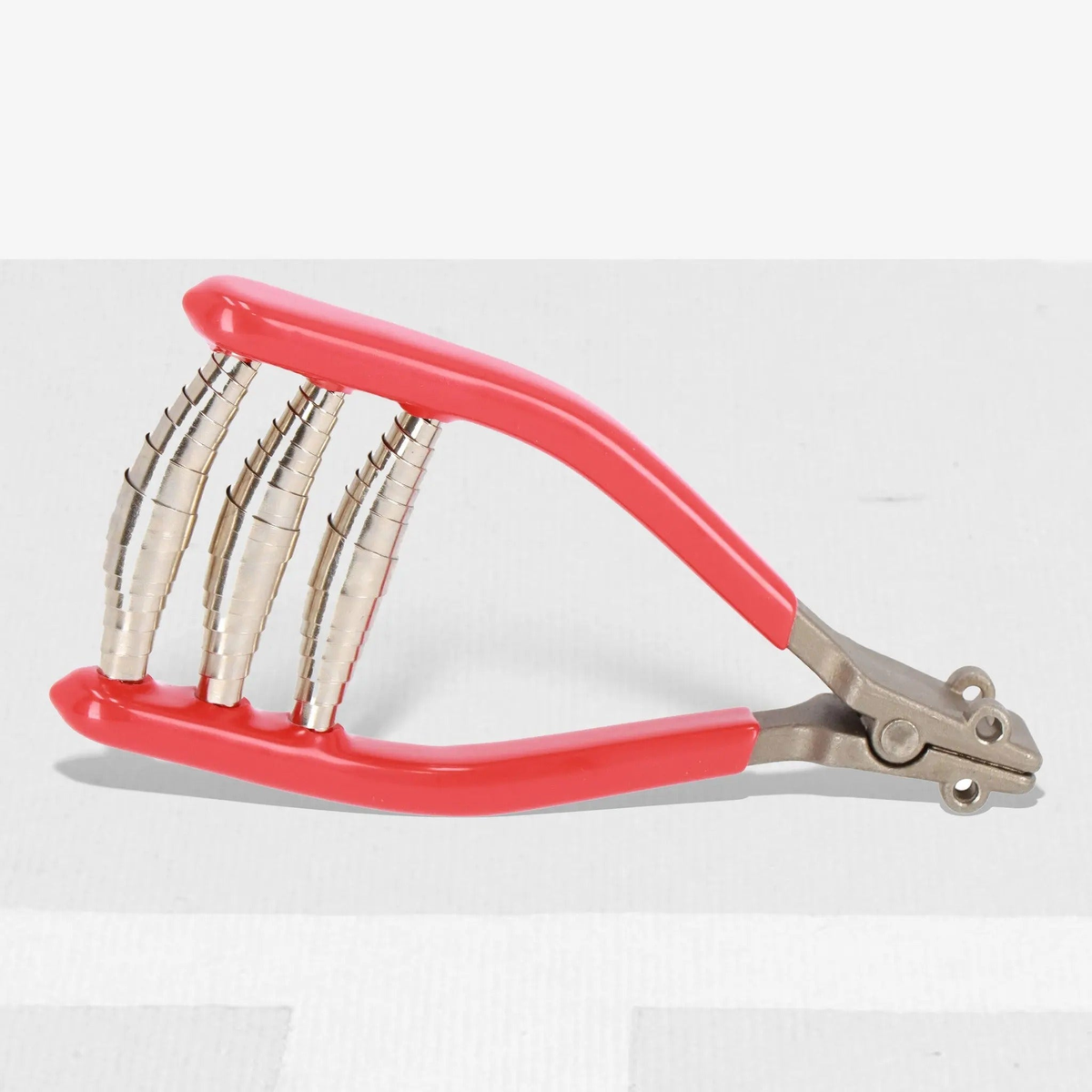 Tennis stringing starting clamp tool with cushioned handles and metal gripping jaws designed to hold strings securely during installation.