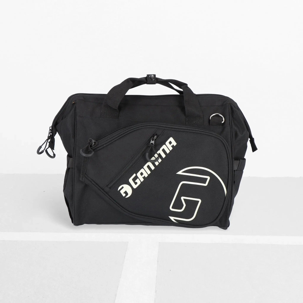 Sport tote bag with carry handles and shoulder strap, featuring multiple zippered compartments and a side pocket for holding a water bottle or gear.