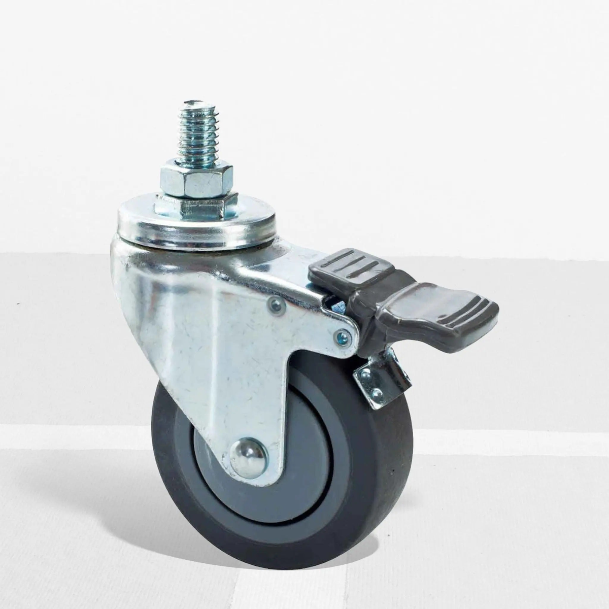 Swivel caster wheel with threaded stem and foot-operated brake, designed for attaching to equipment stands for mobility and stability.