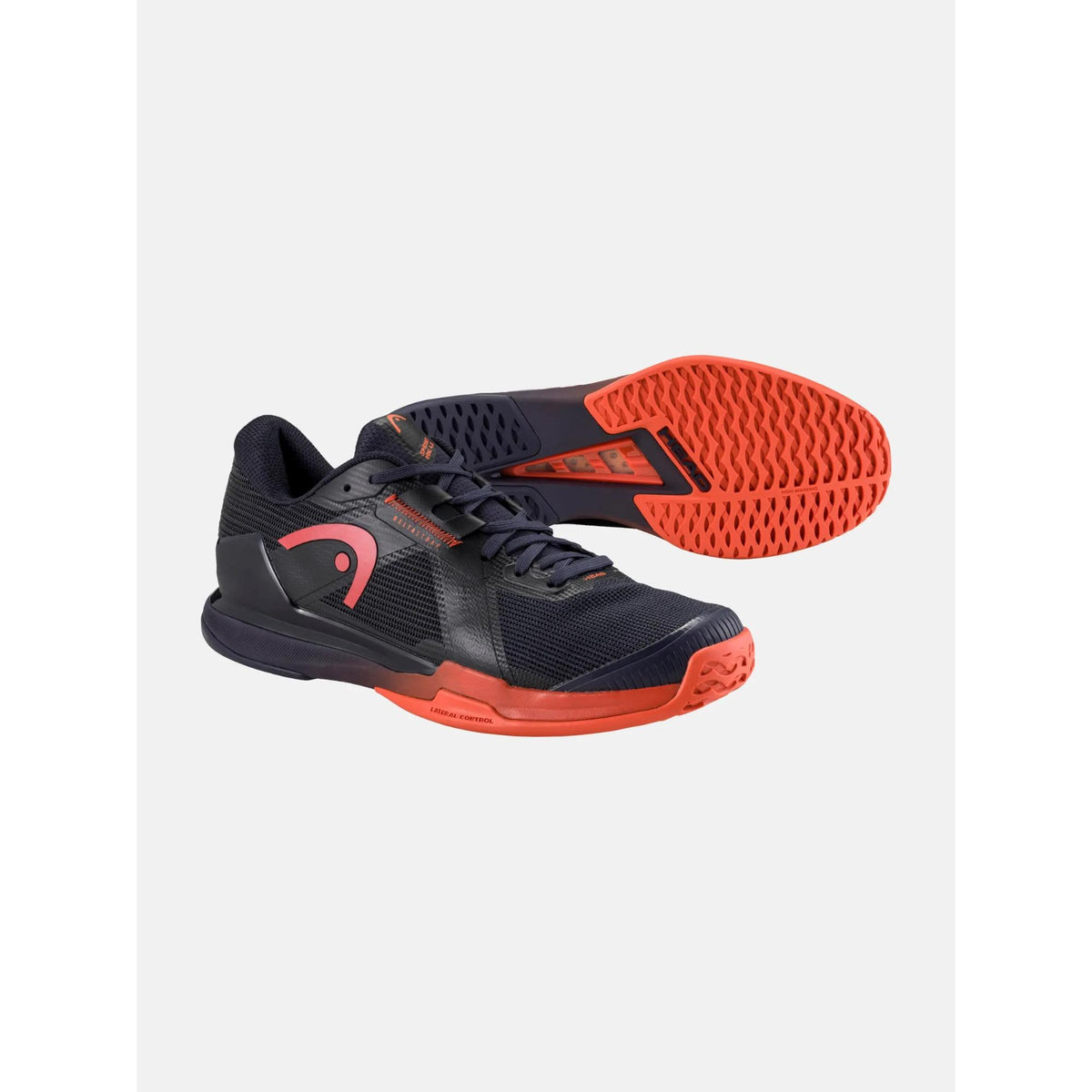 Product image of HEAD Sprint Pro 4.0 men’s tennis shoes in dark navy and black with bright red accents, shown with a side profile and outsole view, highlighting the lightweight mesh upper, reinforced toe guard, lateral stability support, and aggressive herringbone traction sole.