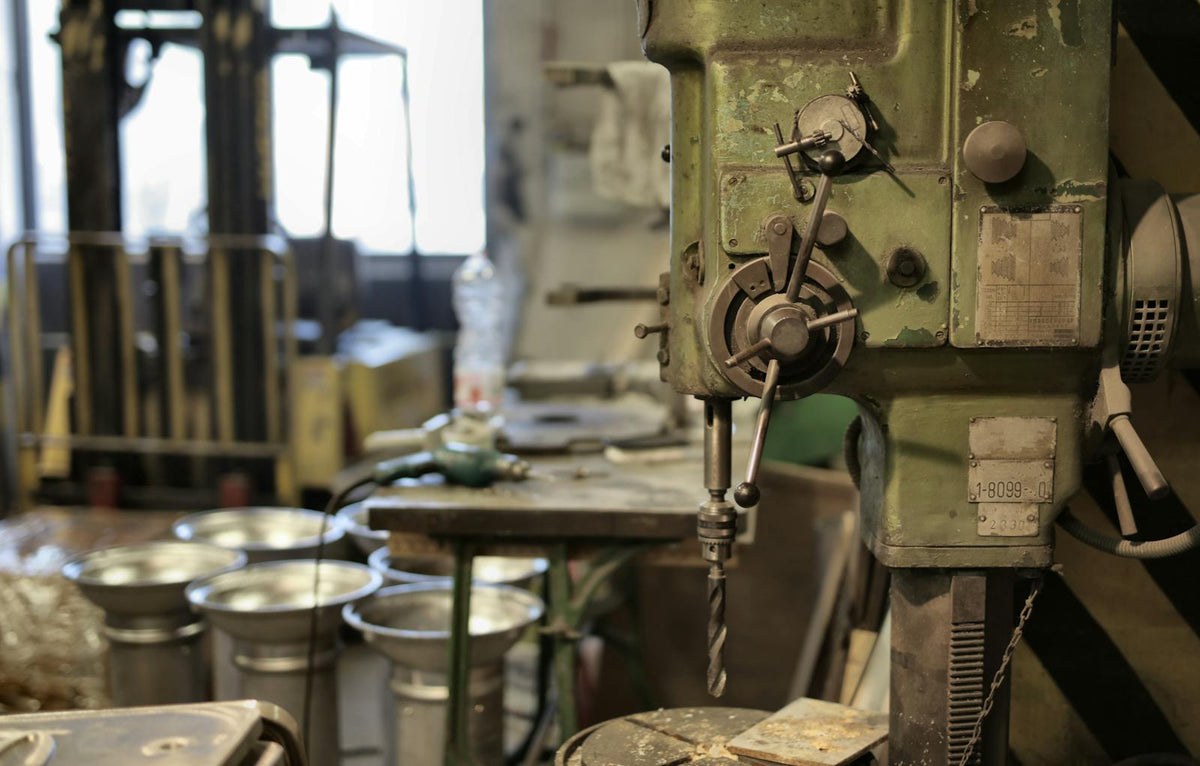 Pro shop drilling machine under workshop lighting