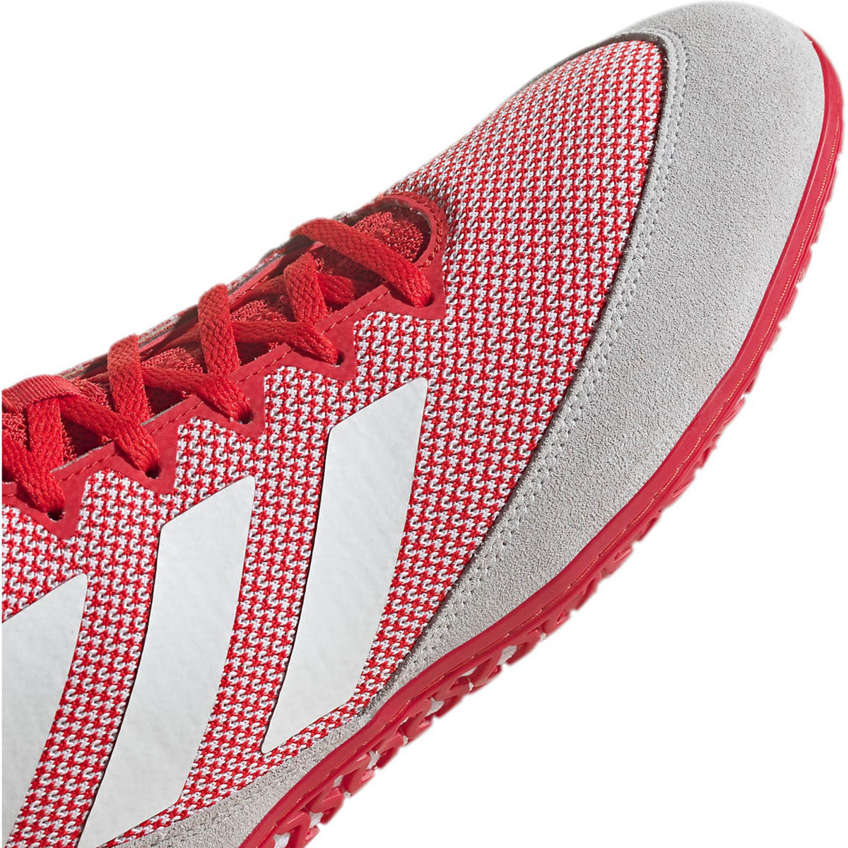 Red high-top wrestling shoes with a breathable knit upper, white three-stripe side branding, and light gray suede-style toe and heel overlays; shown in side and sole views, featuring a red rubber outsole with a dense honeycomb traction pattern and Adidas logo for grip and mat control.