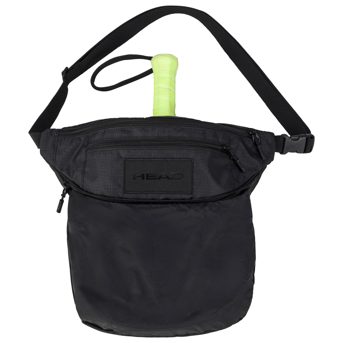 Black HEAD tour crossbody bag shown front-facing on a white background, featuring an adjustable shoulder strap, multiple zippered compartments, an embossed HEAD logo on the front panel, and a tennis racket handle visible from the top opening.