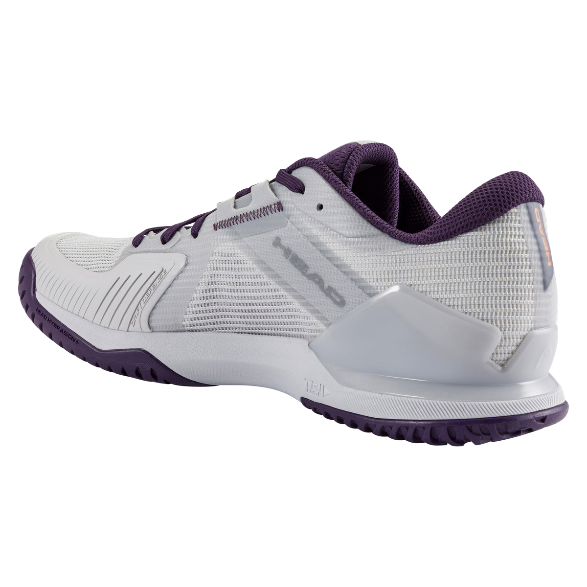 A studio product image of the HEAD Sprint Pro 4.0 men’s tennis shoe in a white and purple colorway on a black background. One shoe is shown in side profile highlighting the breathable mesh upper, DeltaStrap support system, and HEAD logo, while the second shoe is positioned behind it to display the purple non-marking outsole with a textured herringbone-style tread and an orange midfoot support element.