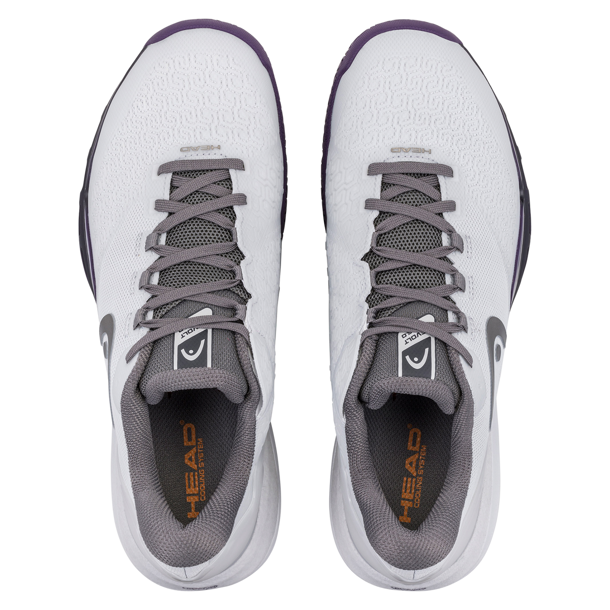 Product image of a white and purple HEAD Revolt Pro men’s tennis shoe on a black background, showing one shoe in side profile with a breathable mesh upper, gray laces, HEAD logo, and cushioned midsole, and a second shoe positioned to display the purple non-marking outsole with traction pattern and stability support.
