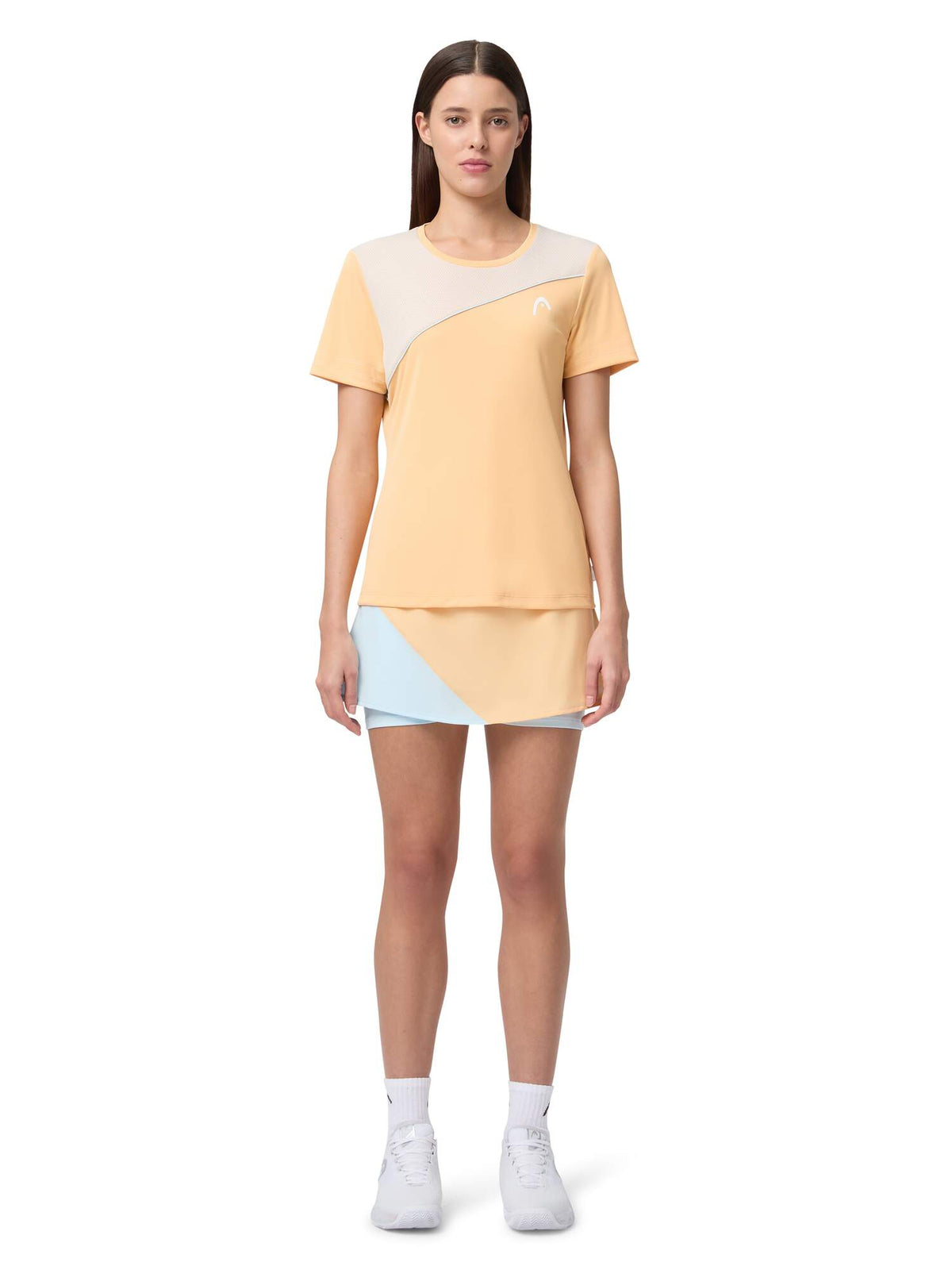HEAD DYNAMIC Womens Tennis Skort in Apricot/Light Blue - model front view