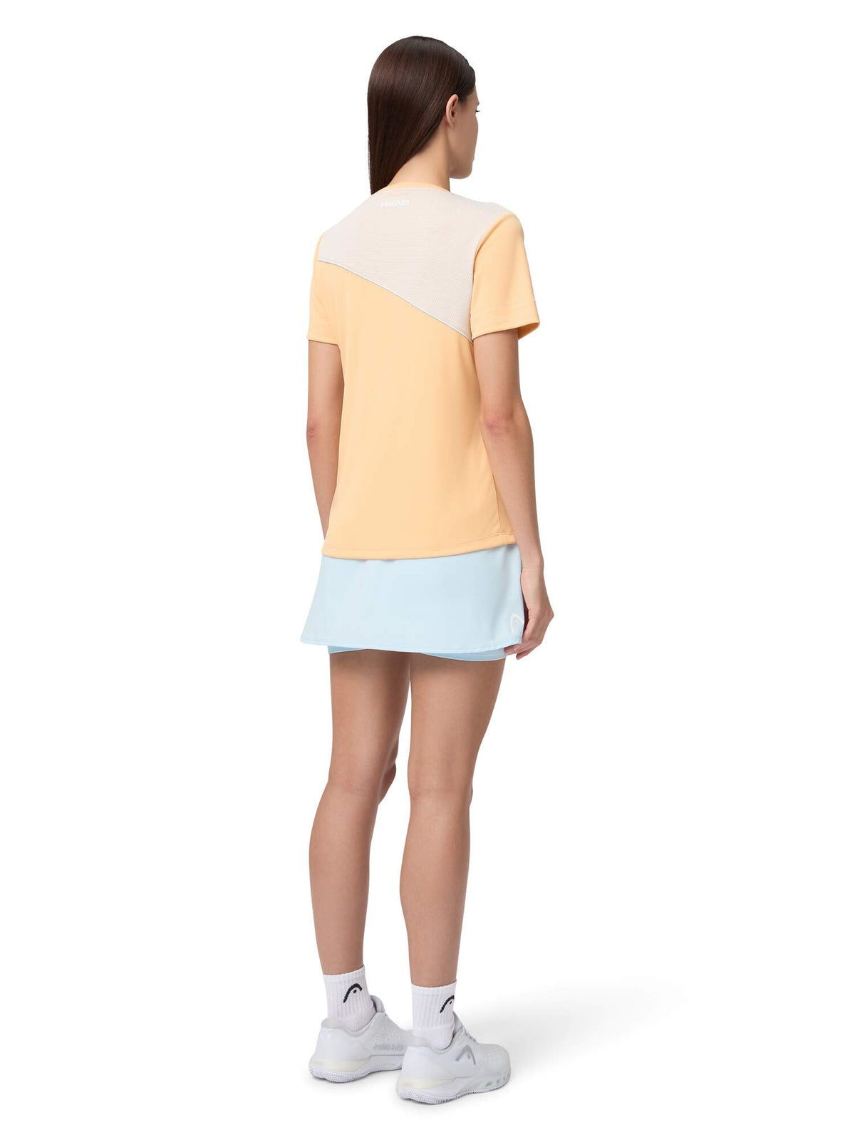 HEAD DYNAMIC Womens Tennis Skort in Apricot/Light Blue - model back view