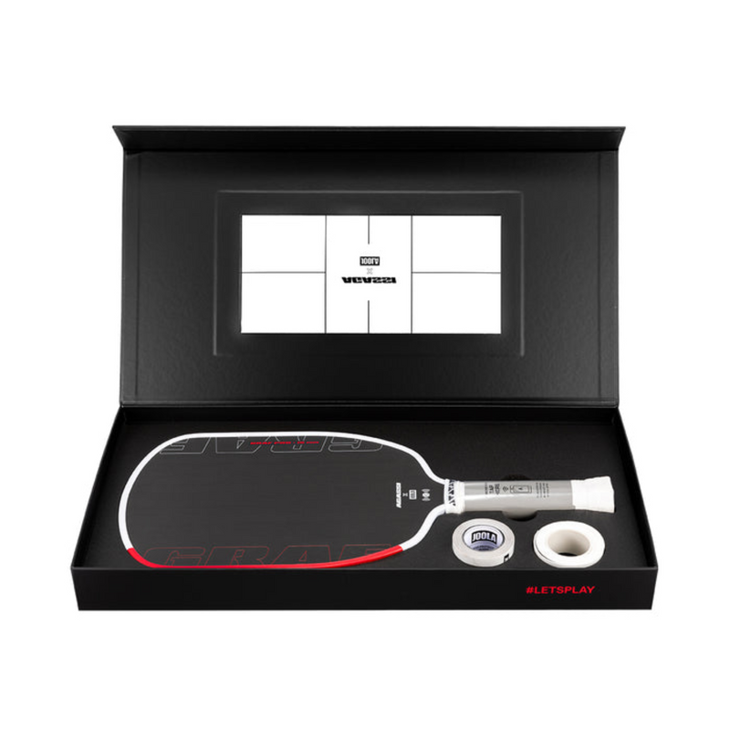 Paddle and ball set in a black box with visible branding on a white background