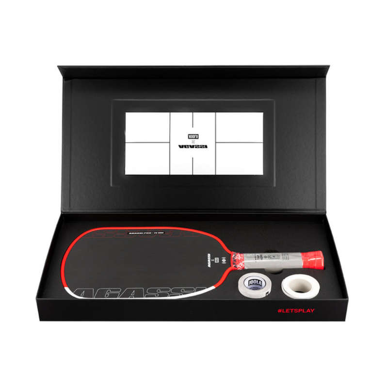 Table tennis racket and accessories in a black display box with a screen showing branding.