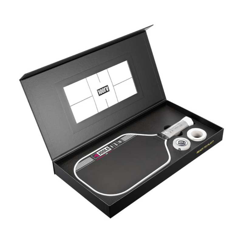 Pickleball paddle and ball set in a black box with a brand logo.