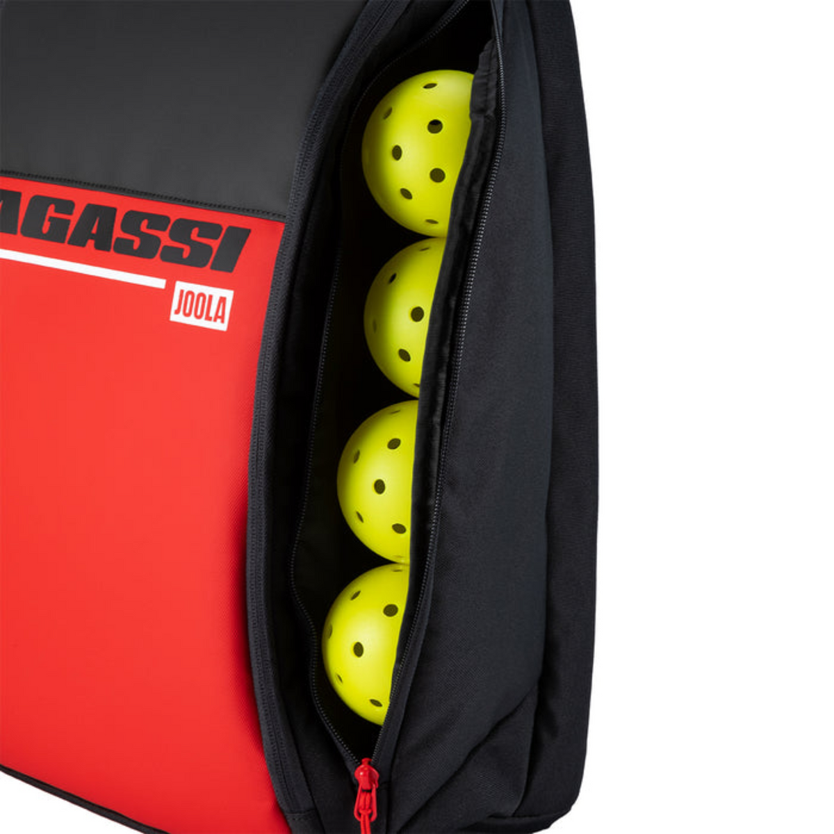 Bag with Joola pickleballs and Agassi branding on a red background