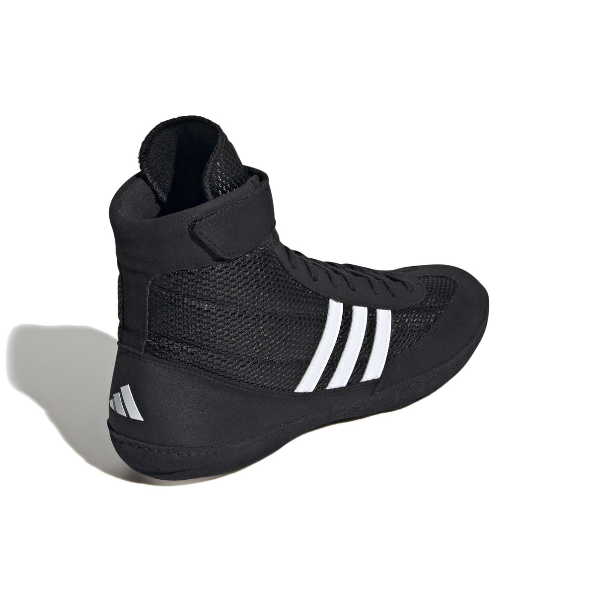 Black high-top wrestling shoe with a breathable mesh upper, black laces, ankle strap for added support, and three white diagonal stripes on the side; shown from side and sole views, featuring a black outsole with white traction pods and Adidas logo for grip, stability, and mat control.
