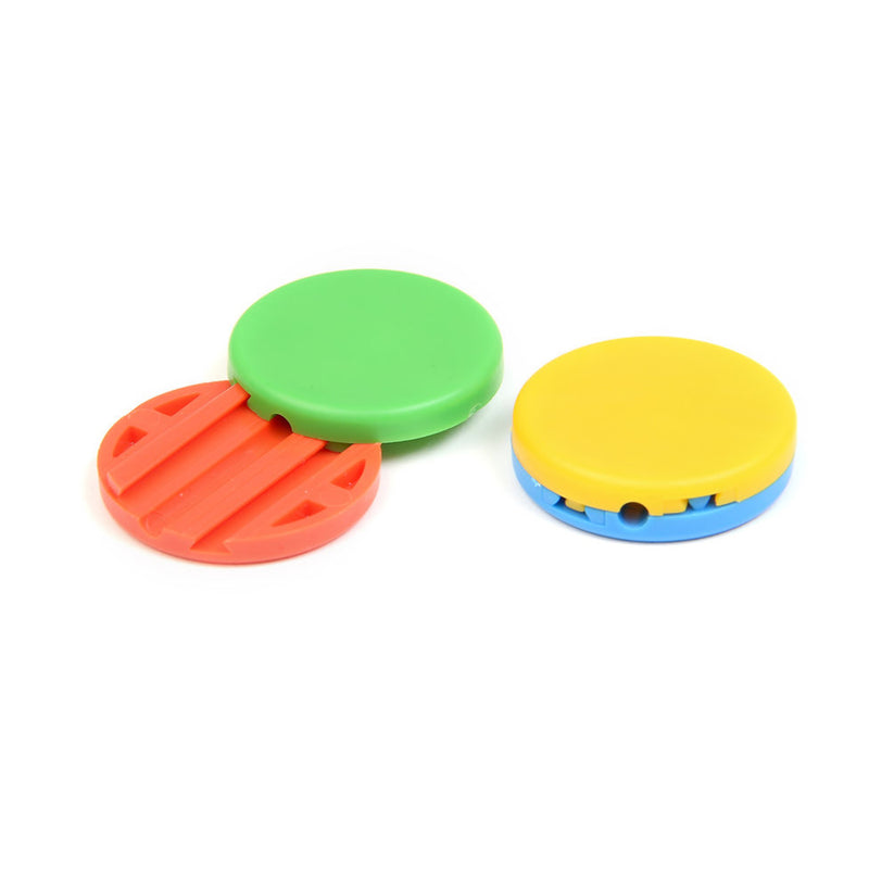 Three colorful round objects on a white background