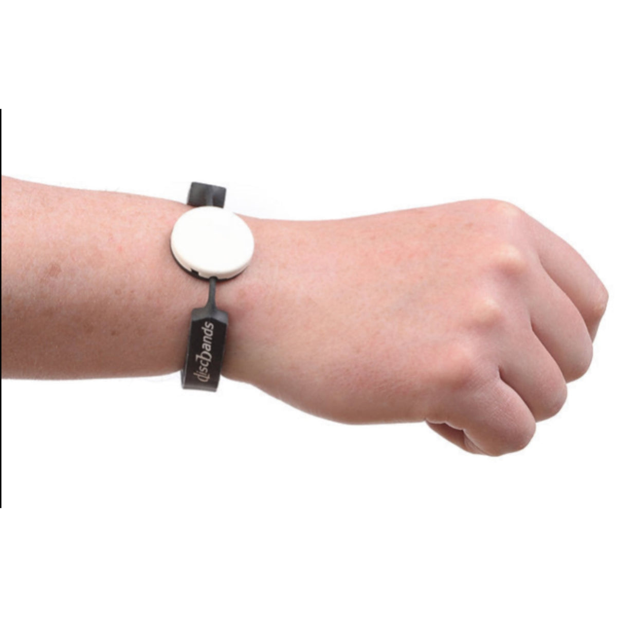 Wrist wearing a white circular device with black strap on a white background