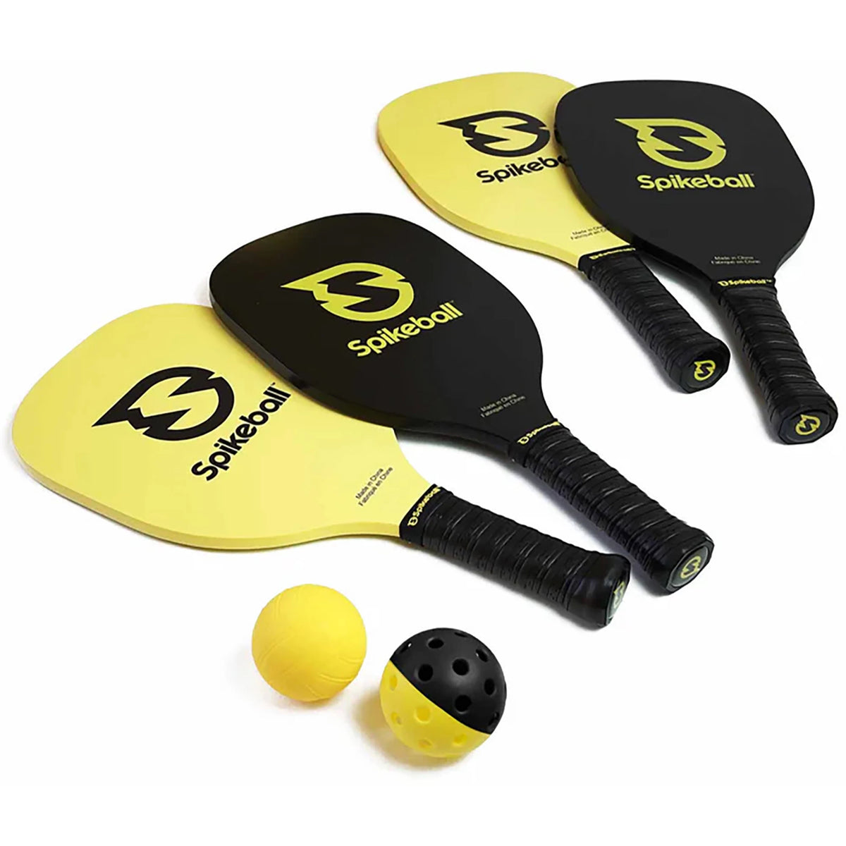 Four Spikeball paddles and two balls on a white background