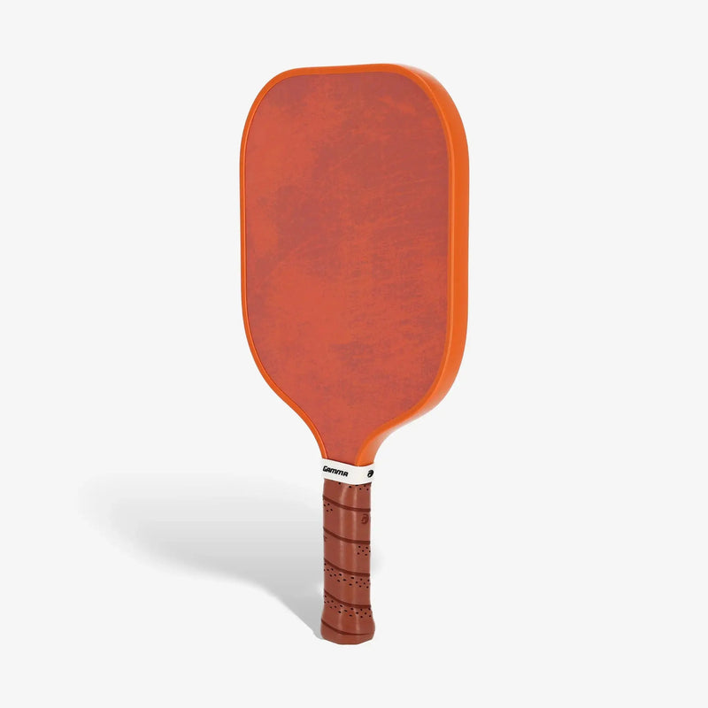 Set of pickleball paddles with wide faces, textured surfaces, and cushioned grip handles designed for power and control.