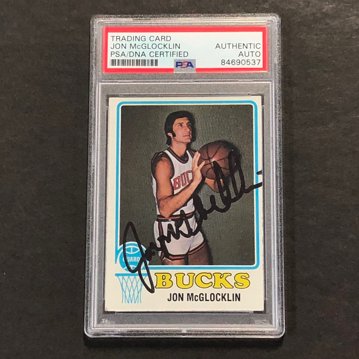 Front of Jon McGlocklin Topps #123 signed card in PSA/DNA holder