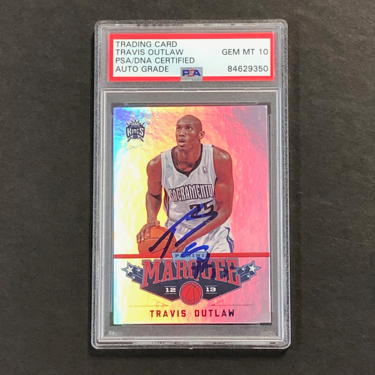 Front of Travis Outlaw Marquee #99 signed card in PSA/DNA holder