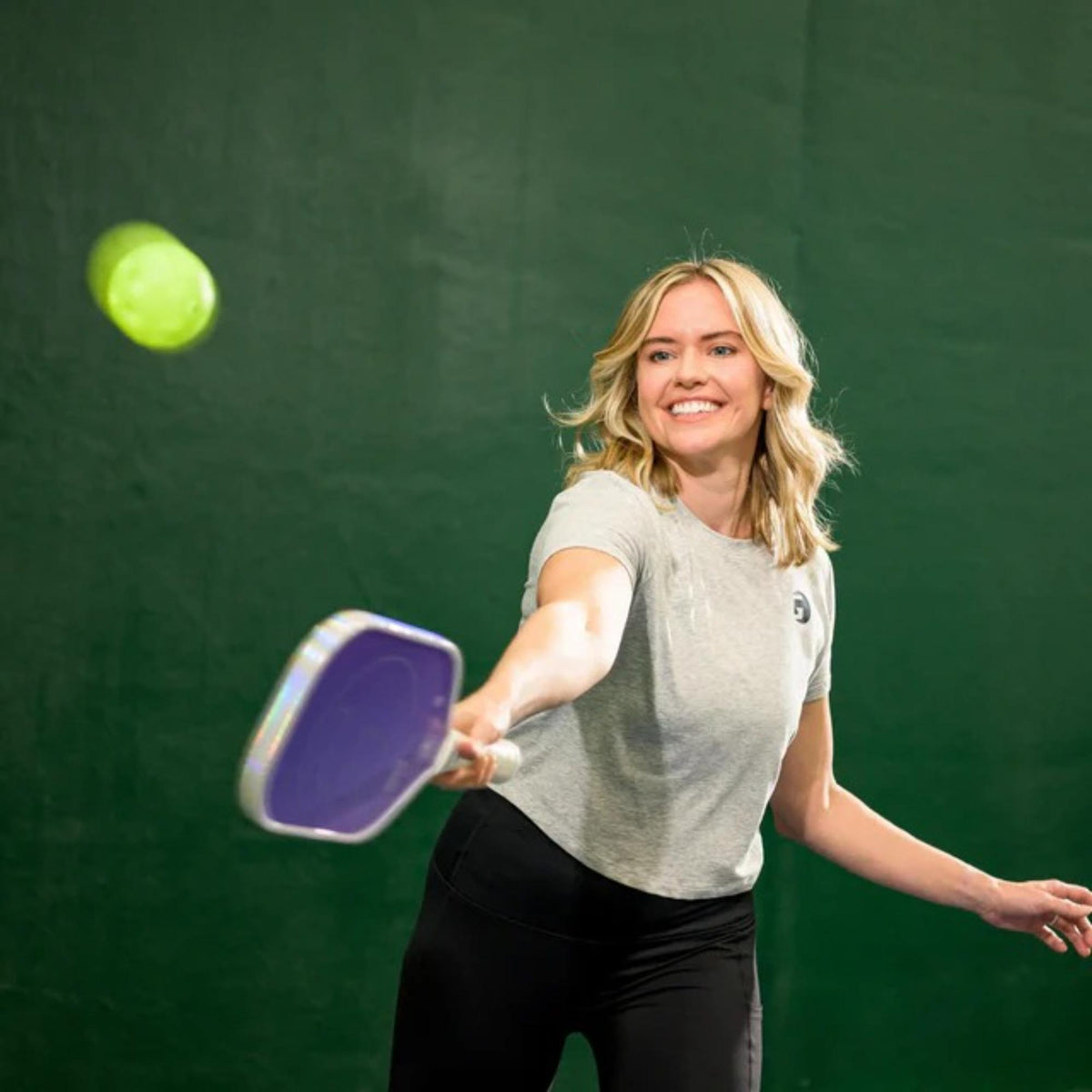 Indoor pickleball with precision-drilled holes, designed for consistent bounce and controlled play on indoor courts.
