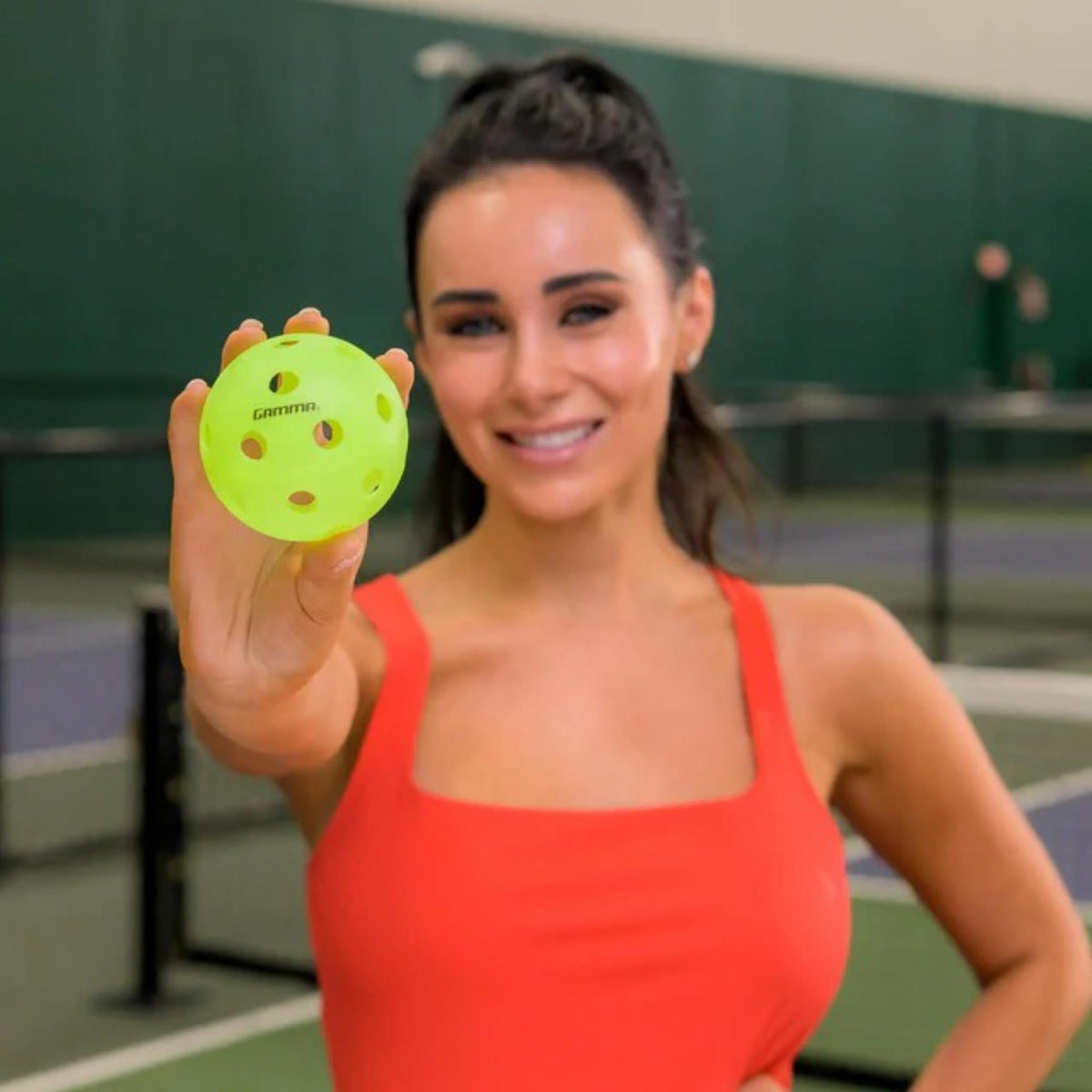 Indoor pickleball with precision-drilled holes, designed for consistent bounce and controlled play on indoor courts.