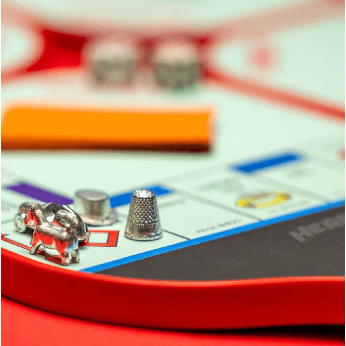 Diadem Monopoly Board 4-paddle starter kit featuring four pickleball paddles with Monopoly board-style graphics, arranged side by side with handles visible.
