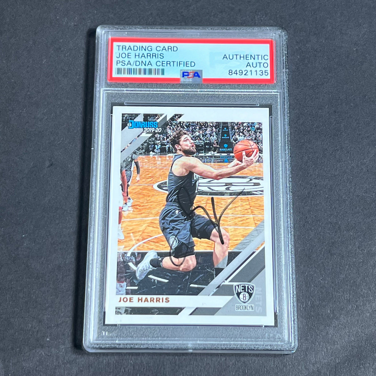 Front of Joe Harris 2019-20 Donruss #20 signed card in PSA/DNA holder