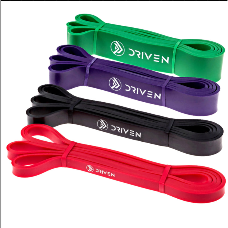 Set of resistance bands in green, purple, black, and red with 'Driven' branding on a white background.