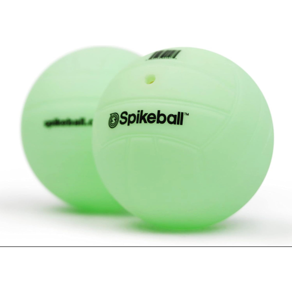 Two green Spikeball balls on a white background