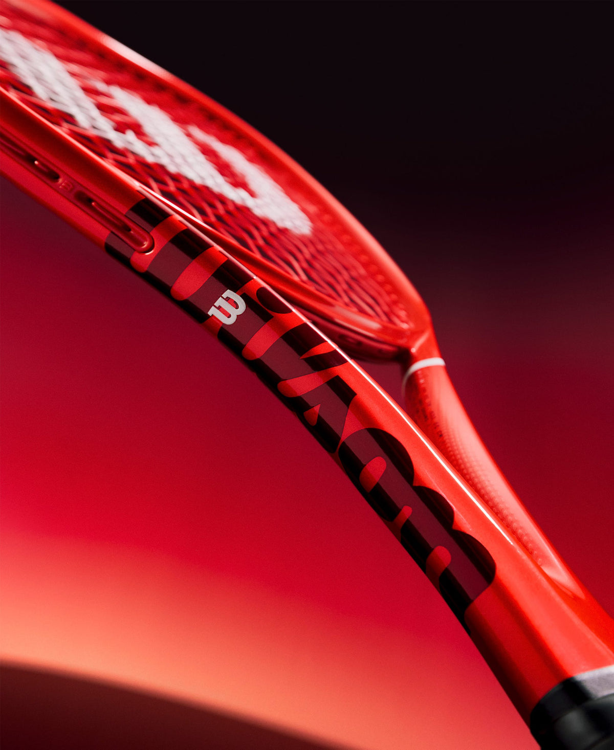 Wilson Defyer 100UL V1 Tennis Racket Unstrung, 9.3 oz in Red - feature detail