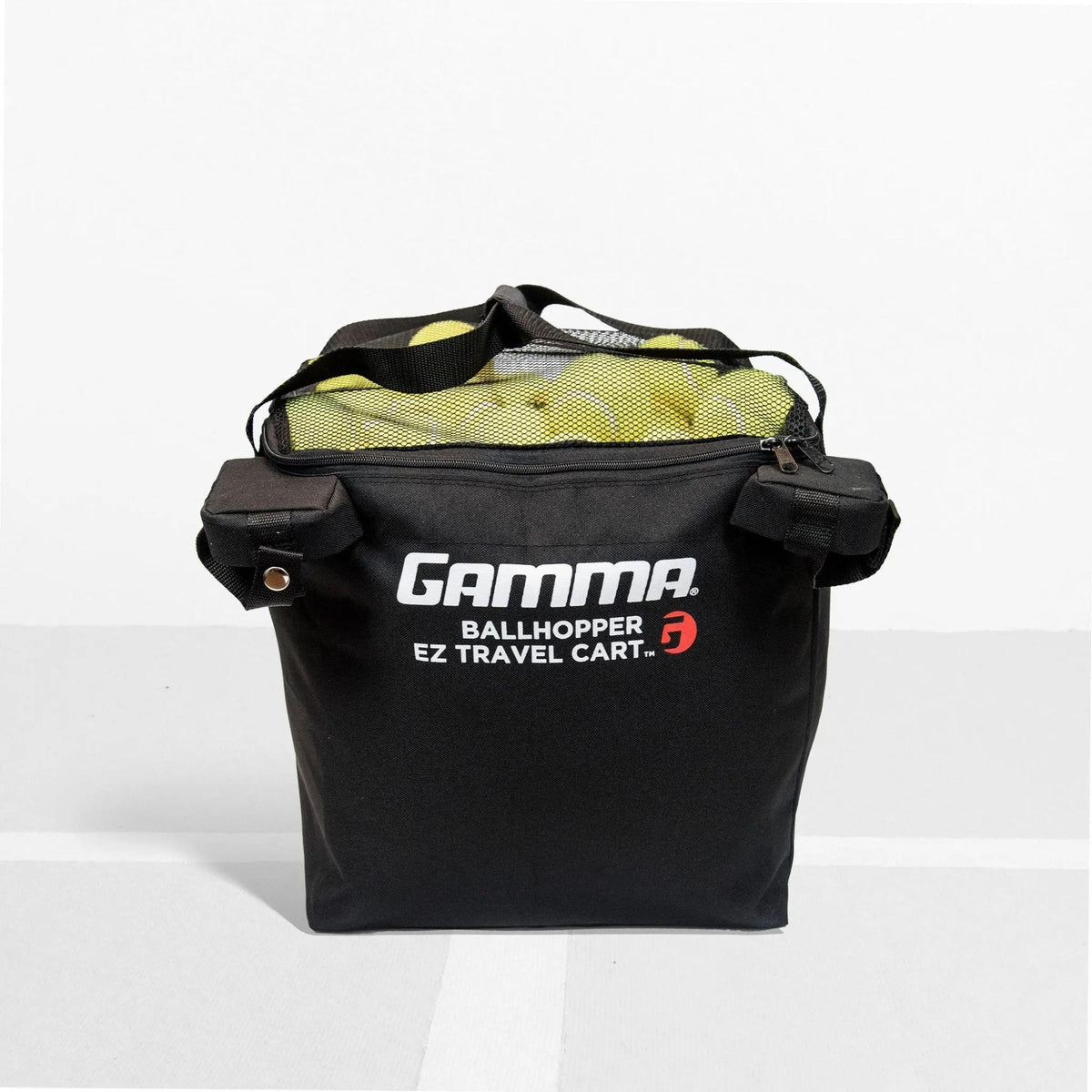 Soft-sided travel cart bag with large main compartment, carry handles, and side pockets, designed for transporting and storing balls and equipment.
