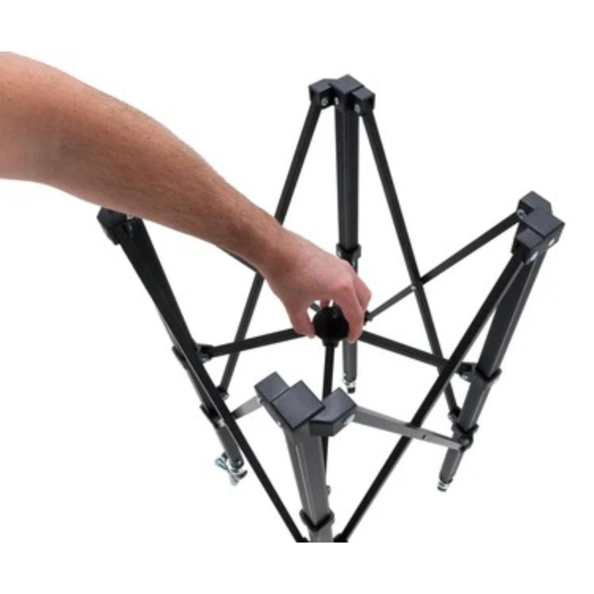 Portable ball hopper cart with rolling wheels, collapsible frame, and attached storage basket for transporting sports balls.
