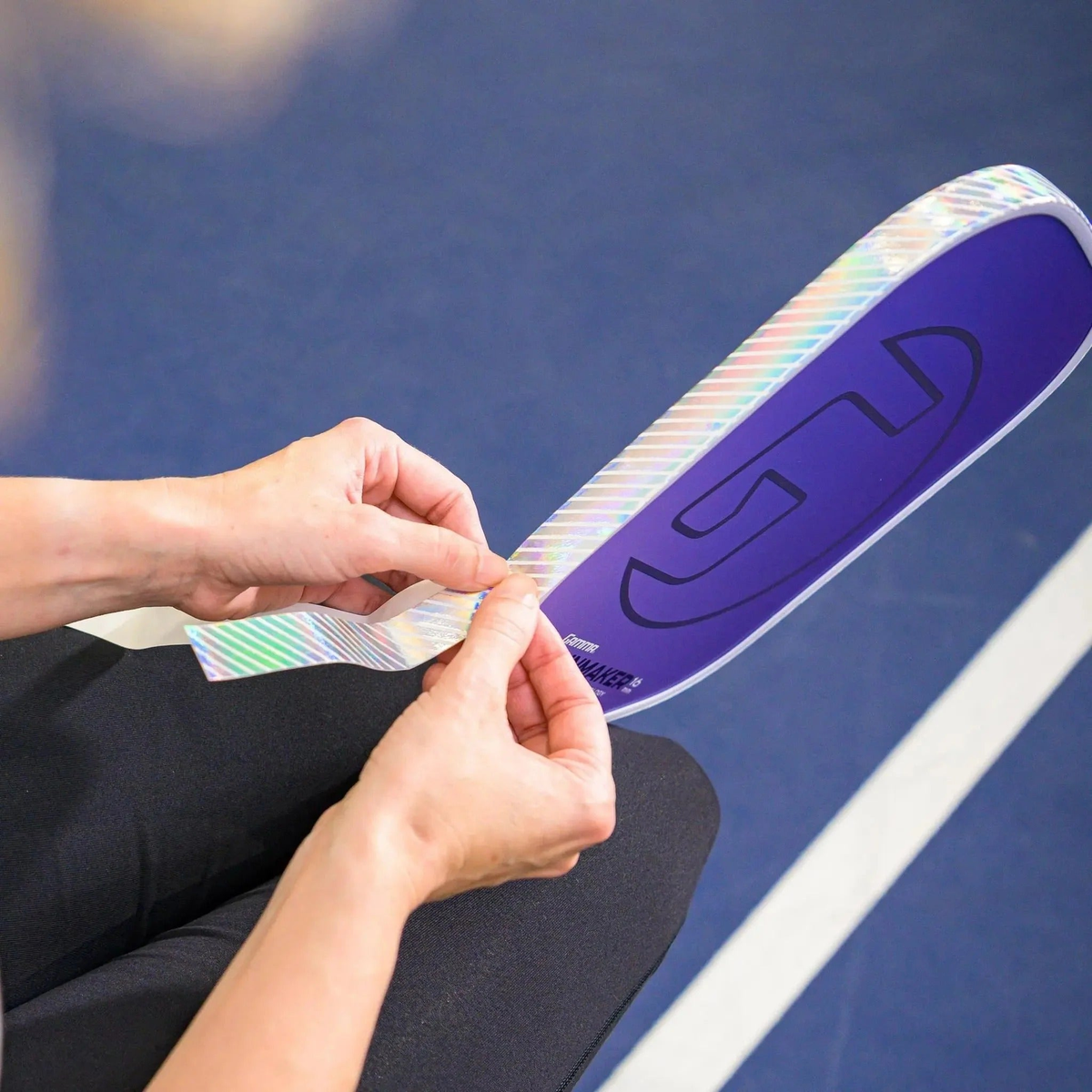 Pickleball paddle edge guard tape with a reflective holographic finish designed to protect paddle edges from wear and impact.