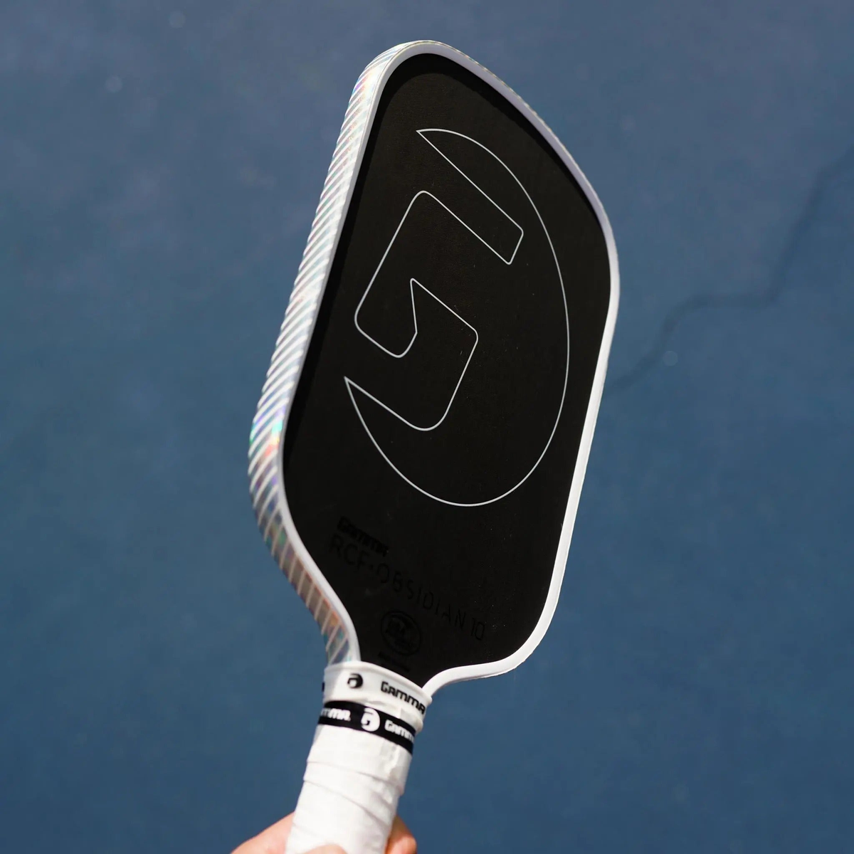Pickleball paddle edge guard tape with a reflective holographic finish, designed to protect paddle edges from wear and damage.