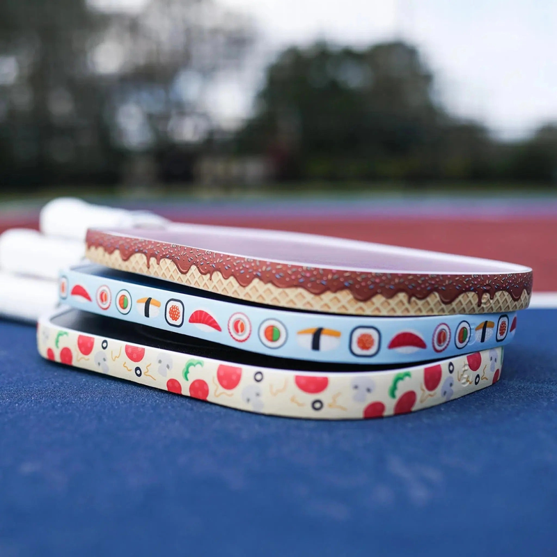 Pickleball paddle edge guard tape with fun food-themed patterns designed to protect paddle edges from wear and damage.