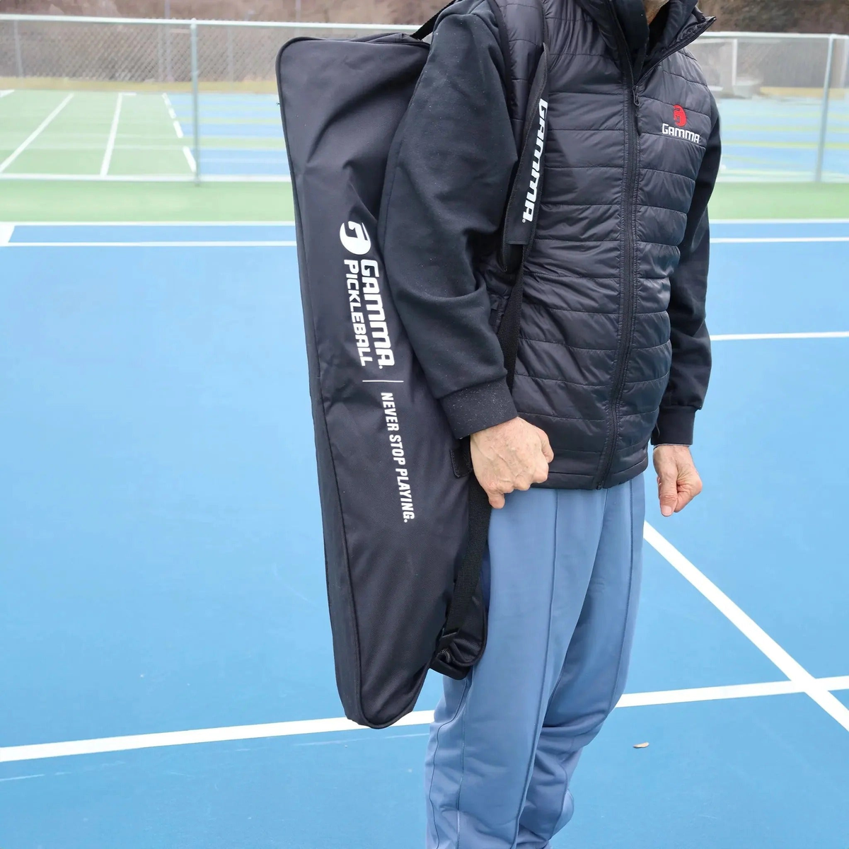 Portable pickleball net system with mesh netting and a stable frame designed for easy setup on a court.