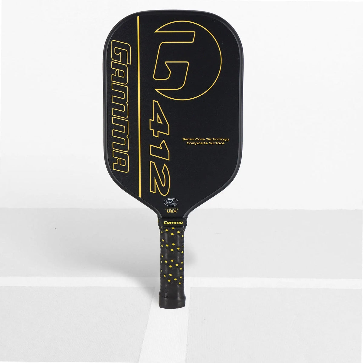 Pickleball paddle with a wide rectangular face, textured hitting surface, and cushioned grip handle featuring a bold graphic design on the front.