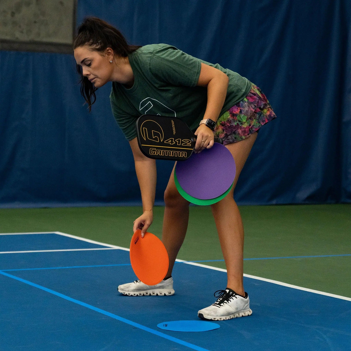 Flat court marker discs designed for training and drills, providing visual targets and positioning guides on playing surfaces.