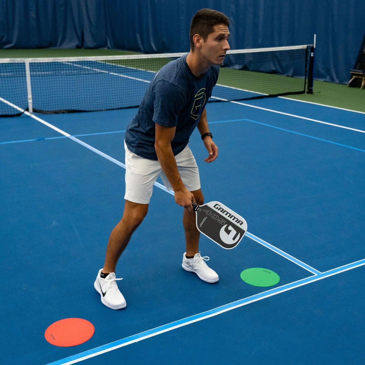 Flat court marker discs designed for training and drills, providing visual targets and positioning guides on playing surfaces.