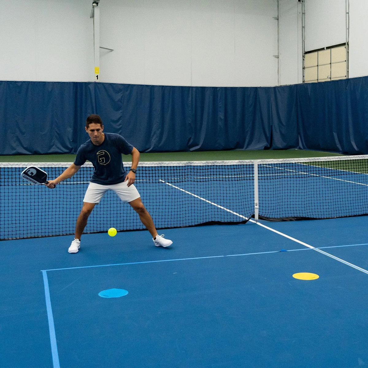Flat court marker discs designed for training and drills, providing visual targets and positioning guides on playing surfaces.