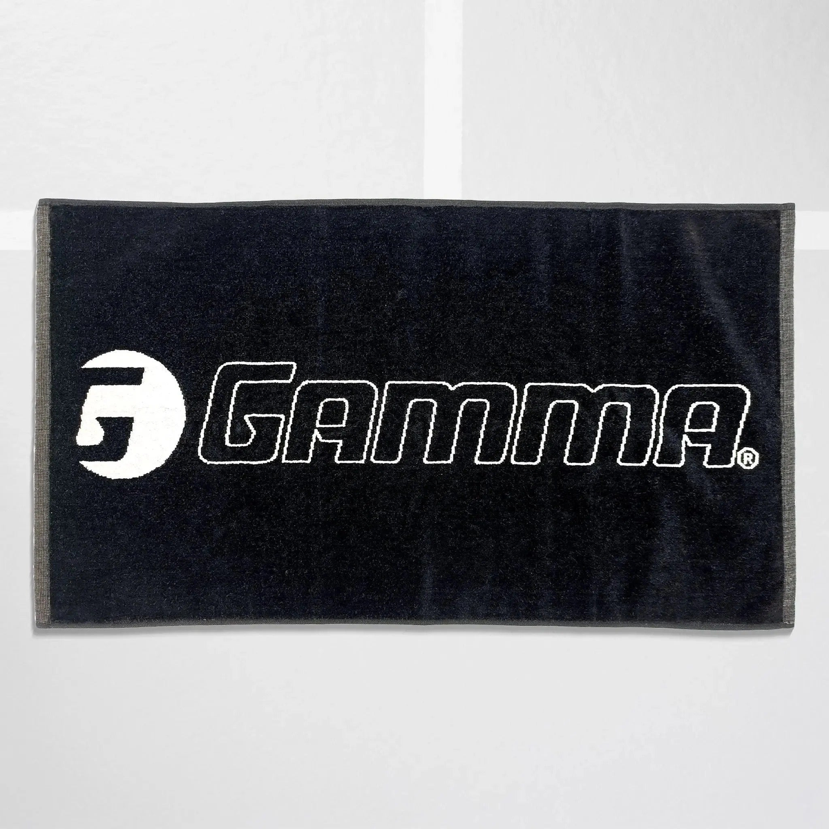Court towel made from absorbent fabric, designed for wiping sweat and keeping hands dry during play.