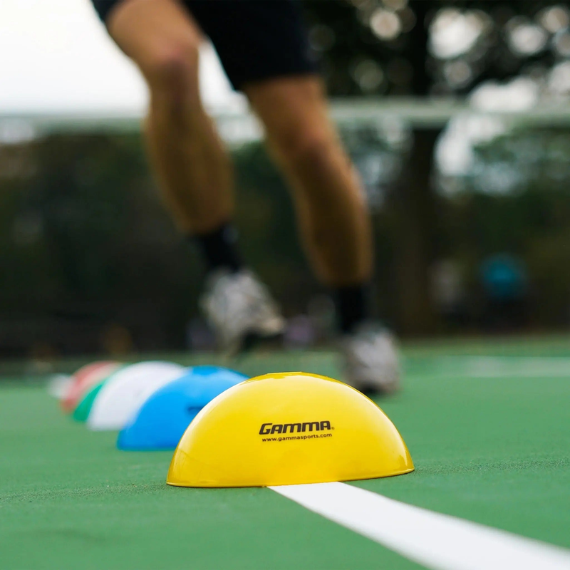 Set of dome-shaped training cones used for marking positions, drills, and boundaries on courts or fields.