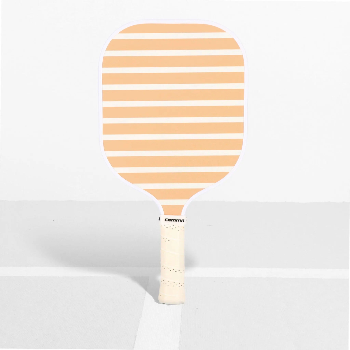 Pickleball paddle with a wide face, striped surface design, and cushioned grip handle for improved control and comfort.